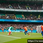 축구 전술 가이드 - A dynamic soccer match scene illustrating the 4-3-3 tactical formation on a lush green stadium pitch...